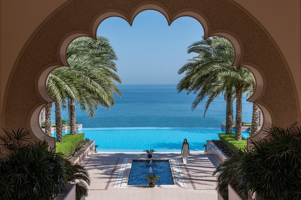 Al Husn pool through courtyard arch B.jpg